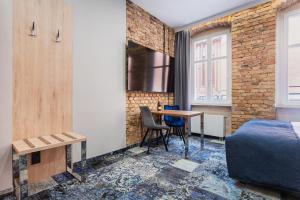 Apartamenty Browar Luxury Old Town Poznań 24h的休息区