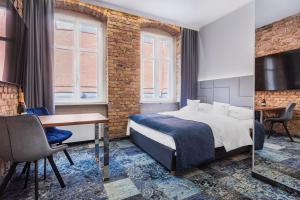 Apartamenty Browar Luxury Old Town Poznań 24h客房内的一张或多张床位