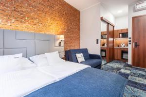 Apartamenty Browar Luxury Old Town Poznań 24h客房内的一张或多张床位