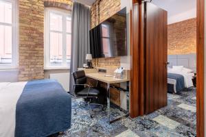 Apartamenty Browar Luxury Old Town Poznań 24h客房内的一张或多张床位