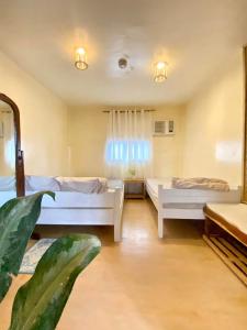 Postel nebo postele na pokoji v ubytování Malayah Hostel