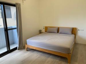 Postel nebo postele na pokoji v ubytování Wei Kun Homestay