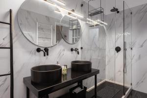 a bathroom with a sink and a mirror at Aniv Villa by the Sea in Kini