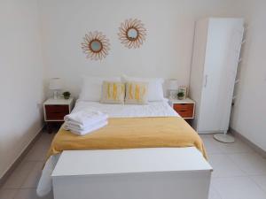 a bedroom with a bed with a mirror on the wall at Salto Chico Apart. in Salto