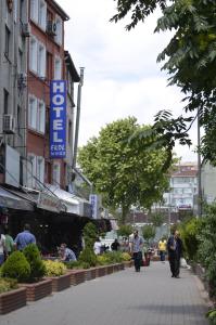 a street with people walking down the street at Ekol Hotel in Istanbul