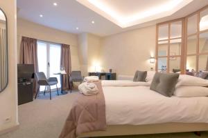TV a/nebo společenská místnost v ubytování Hotel Lugano