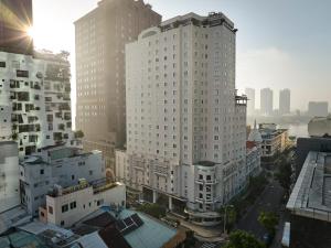 an aerial view of a city with tall buildings at Hotel Grand Saigon in Ho Chi Minh City