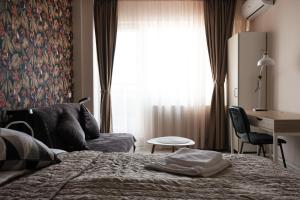 Giường trong phòng chung tại Konstanzer Q-Residence - 1 camera, bucaterie, aer conditionat, masina de spolat