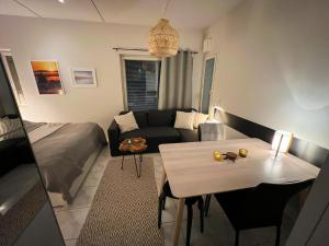 a living room with a couch and a table at Ylläs Kanerva 108 in Ylläs +27 photos