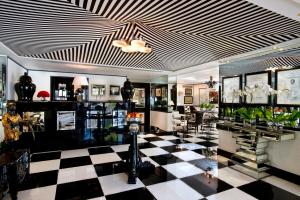 a lobby with a black and white checkered floor at Duke Of Richmond Hotel in St. Peter Port