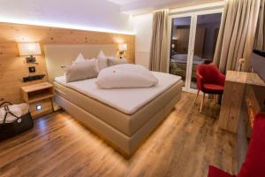Voodi või voodid majutusasutuse Hotel Bergkristall toas