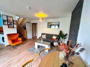 a living room with a couch and a table at Seascape Bliss - Coastal Retreat in Youghal`s heart - Family Friendly - Long Term Price Cuts in Youghal