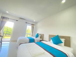Een bed of bedden in een kamer bij O Mary River Resort