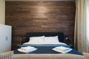 Giường trong phòng chung tại Konstanzer 95 - 1 camera, bucaterie, aer conditionat, masina de sopalat