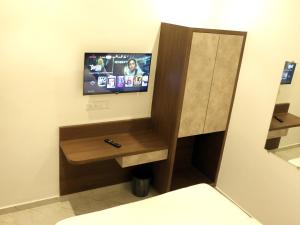 TV a/nebo společenská místnost v ubytování Hotel Majestic