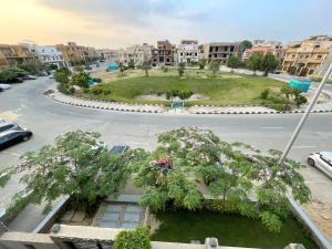 a park in a city with trees and buildings at Elegant Garden-view 1BR in New Cairo in Cairo