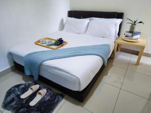 Posteľ alebo postele v izbe v ubytovaní Dwiputra Residence Presint 15 PutraJAYA