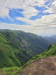 a view of a green valley from the top of a mountain at Moss Adams Inn in Vagamon