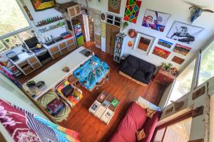 an overhead view of a living room with a couch at In The Green Backpackers in Morganʼs Bay