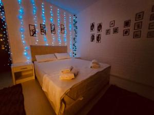 a bedroom with a bed with lights on it at Elda White Angel in Side