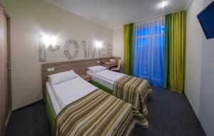 Postel nebo postele na pokoji v ubytování Raziotel Kyiv (Boryspilska)