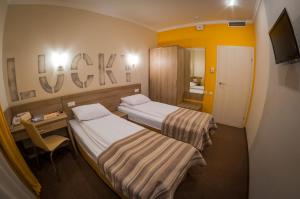 Postel nebo postele na pokoji v ubytování Raziotel Kyiv (Boryspilska)