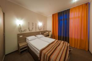 Postel nebo postele na pokoji v ubytování Raziotel Kyiv (Boryspilska)