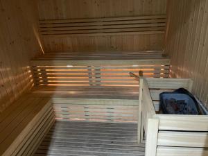 an inside of a sauna with a suitcase in it at Great view, Dubai SportCity, parking included, nice Apartments in Dubai