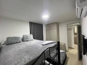 Postel nebo postele na pokoji v ubytování Hermoso apartamento para descansar en familia