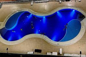 Bazén v ubytování Hermoso apartamento para descansar en familia nebo v jeho okolí