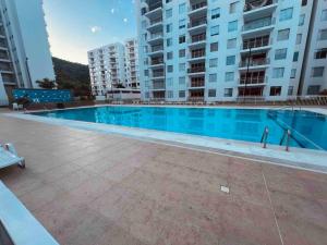 Bazén v ubytování Hermoso apartamento para descansar en familia nebo v jeho okolí