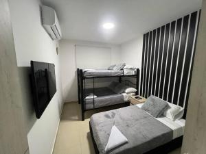 Postel nebo postele na pokoji v ubytování Hermoso apartamento para descansar en familia
