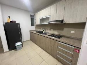 Kuchyň nebo kuchyňský kout v ubytování Hermoso apartamento para descansar en familia