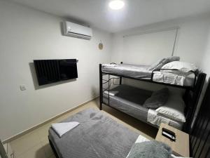 Postel nebo postele na pokoji v ubytování Hermoso apartamento para descansar en familia