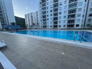 Bazén v ubytování Hermoso apartamento para descansar en familia nebo v jeho okolí