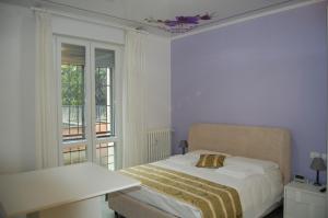 Posteľ alebo postele v izbe v ubytovaní Orchidea