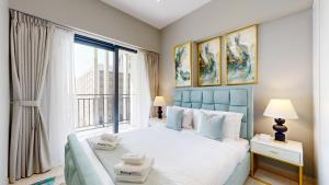 Postel nebo postele na pokoji v ubytování Primestay - DAMAC Zada 1BR, Business Bay