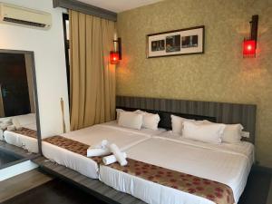 Postel nebo postele na pokoji v ubytování I Garden Hotel