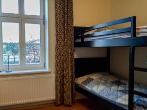 a bunk bed in a room with a window at Apartment Klausdorf in Klausdorf Mecklenburg Vorpommern