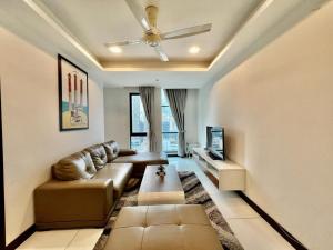 a living room with a couch and a ceiling fan at BBHomes at Casa Residency KL in Kuala Lumpur