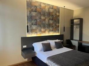 Postel nebo postele na pokoji v ubytování B&B MariLù