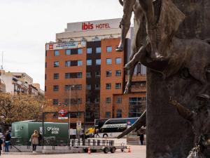 a statue of a person riding a horse in a city at Ibis Madrid Centro las Ventas in Madrid