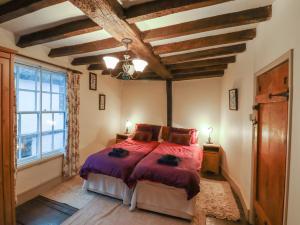 a bedroom with a bed and a large window at Flushing House in Rye