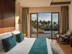 Postel nebo postele na pokoji v ubytování Mövenpick Resort Cam Ranh