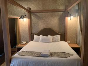 Postel nebo postele na pokoji v ubytování I Garden Hotel