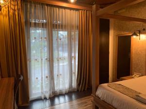 Postel nebo postele na pokoji v ubytování I Garden Hotel