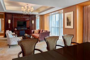 a living room with a table and chairs at The Westin Hefei Baohe in Hefei