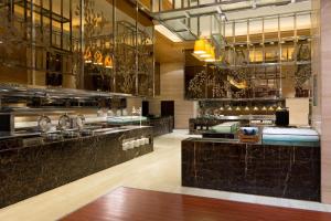 a lobby of a hotel with a bar at The Westin Hefei Baohe in Hefei