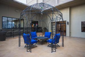 a gazebo with a table and chairs in a room at Stay Together Suites in Las Vegas