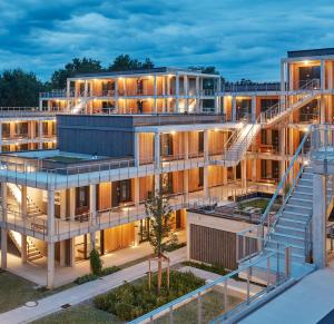 an exterior view of a building with stairs at NUNA – nachhaltig schlafen in Rosenheim